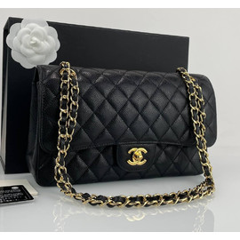 Кожаная черная сумка Chanel 11.12 Medium Classic Flap Bag Caviar